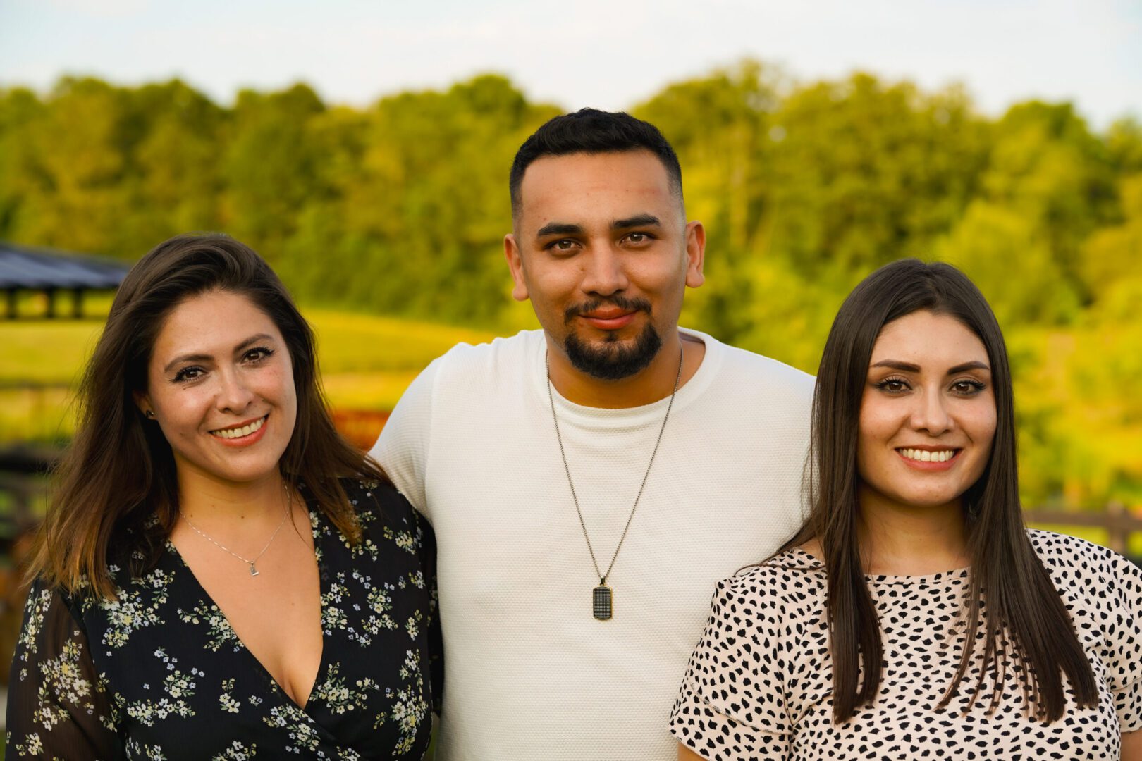 Smiling friends outdoors in summer