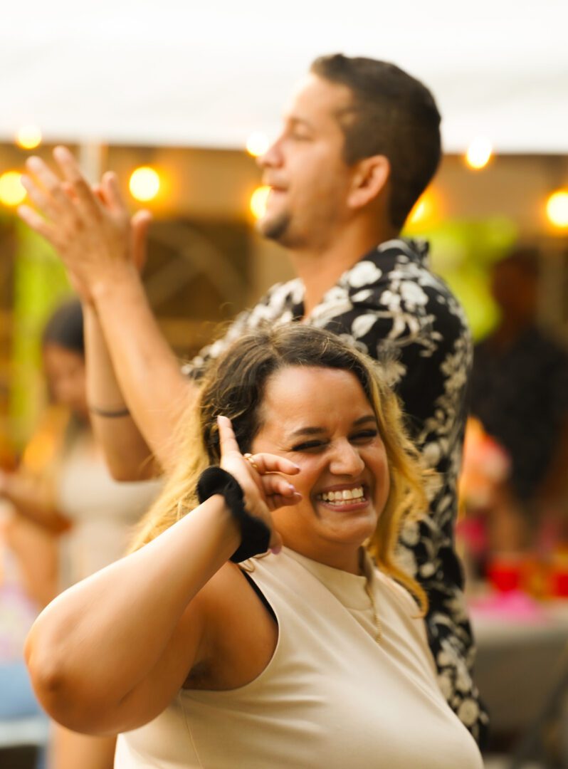 Woman smiling and dancing at party