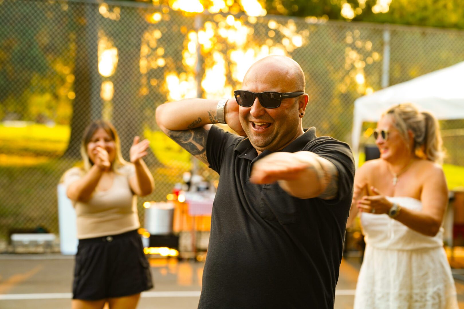 Man celebrating with friends outside