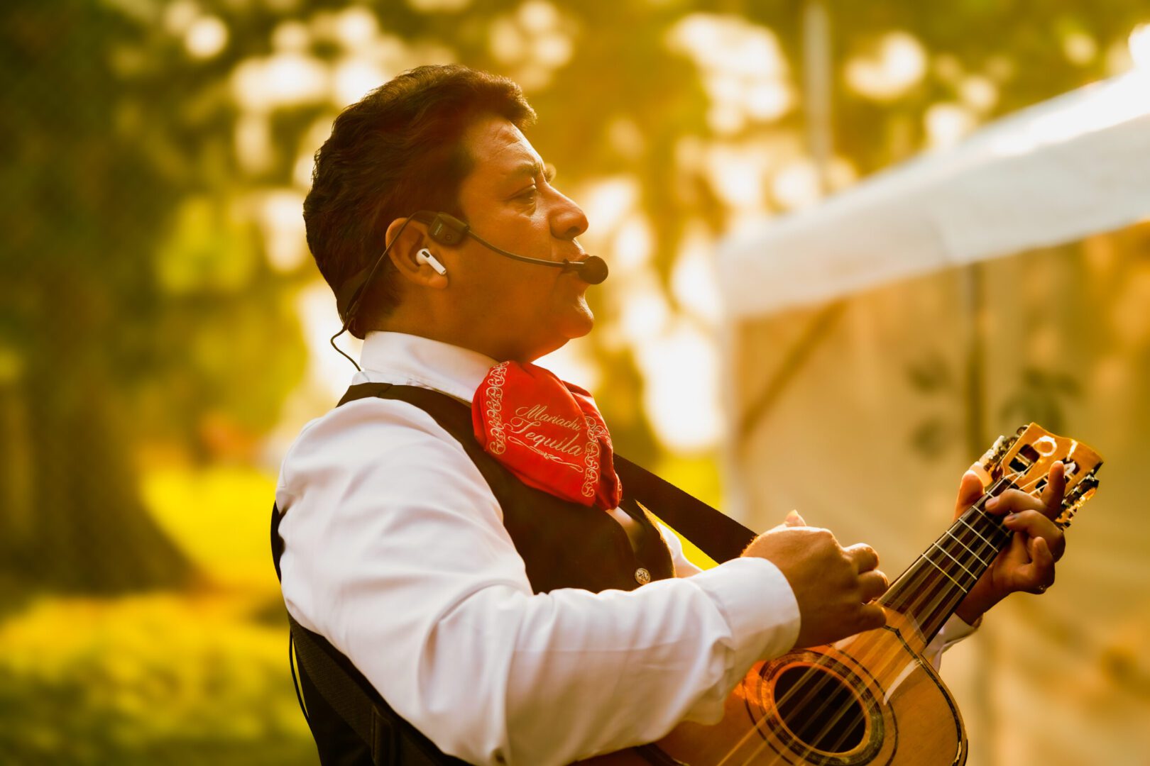 Man playing guitar in sunlight