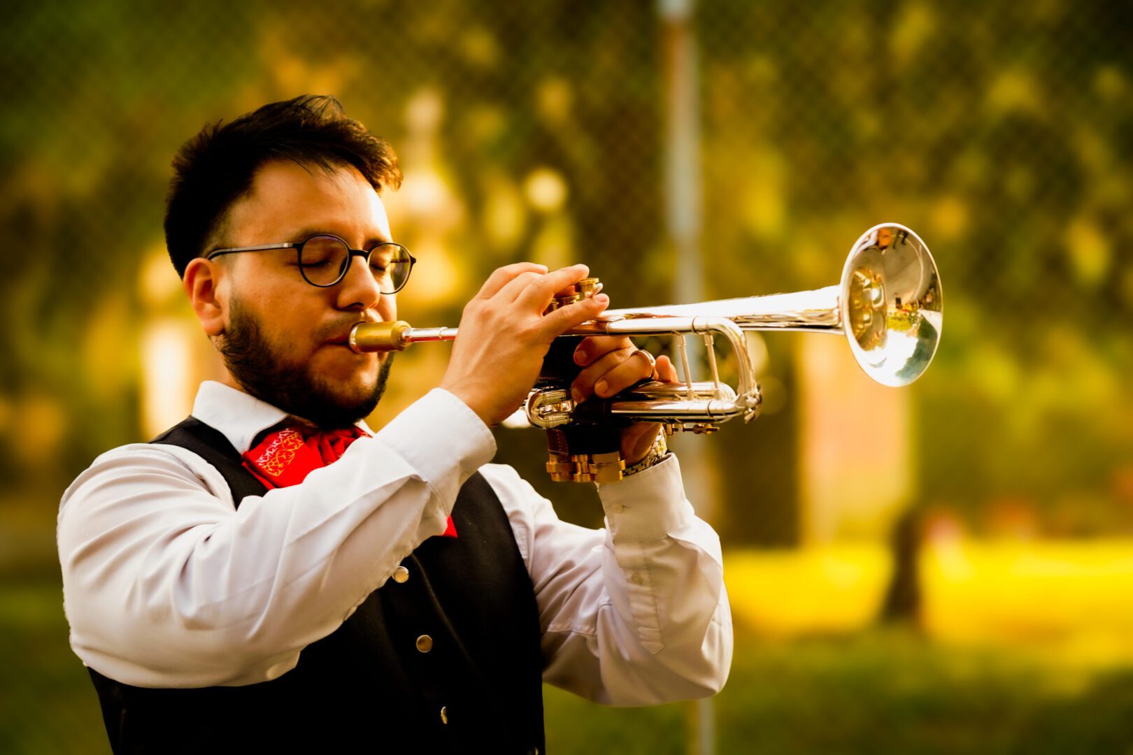 Musician playing trumpet outdoors