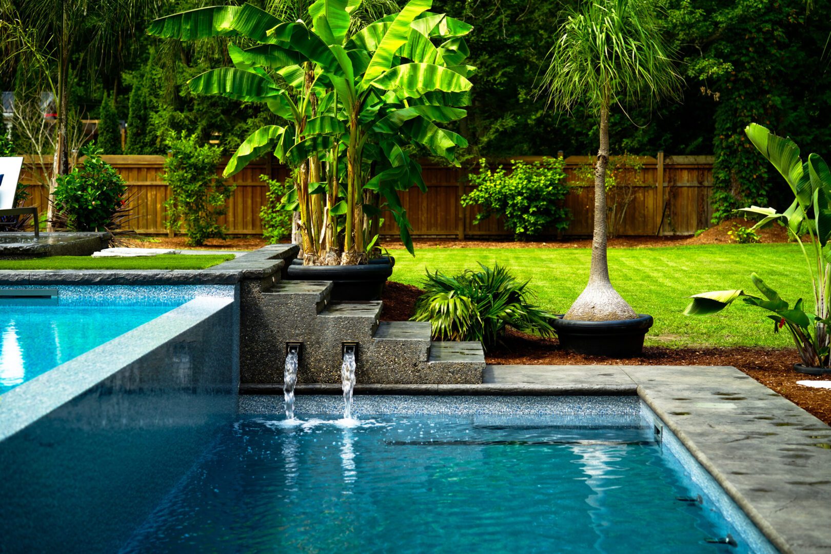 Elegant garden pool surrounded by palms